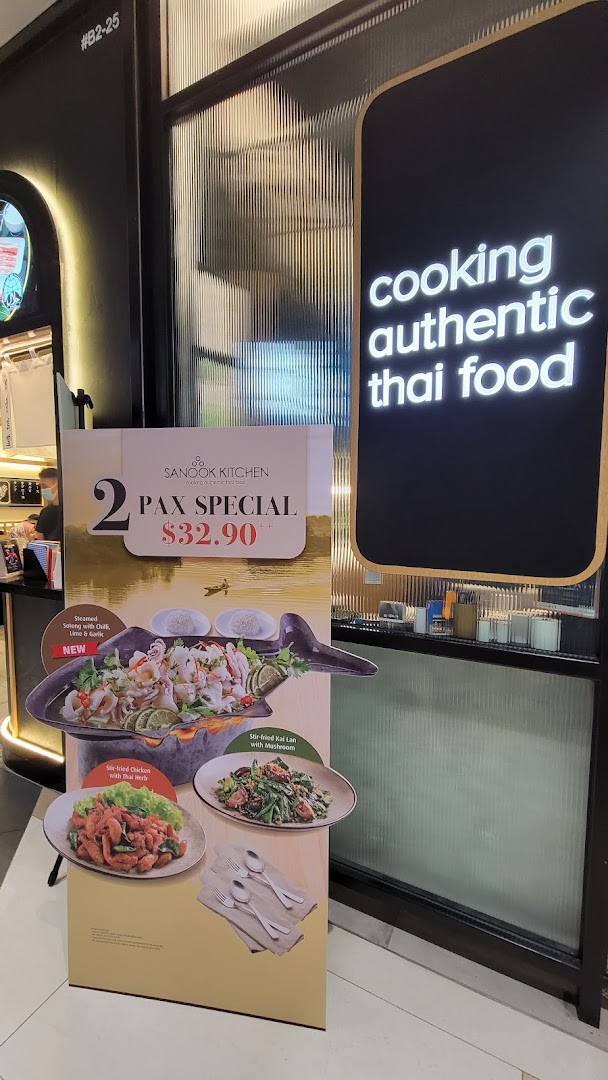 A promotional stand for a 2 Pax Special at Sanook Kitchen's entrance, featuring Thai dishes.