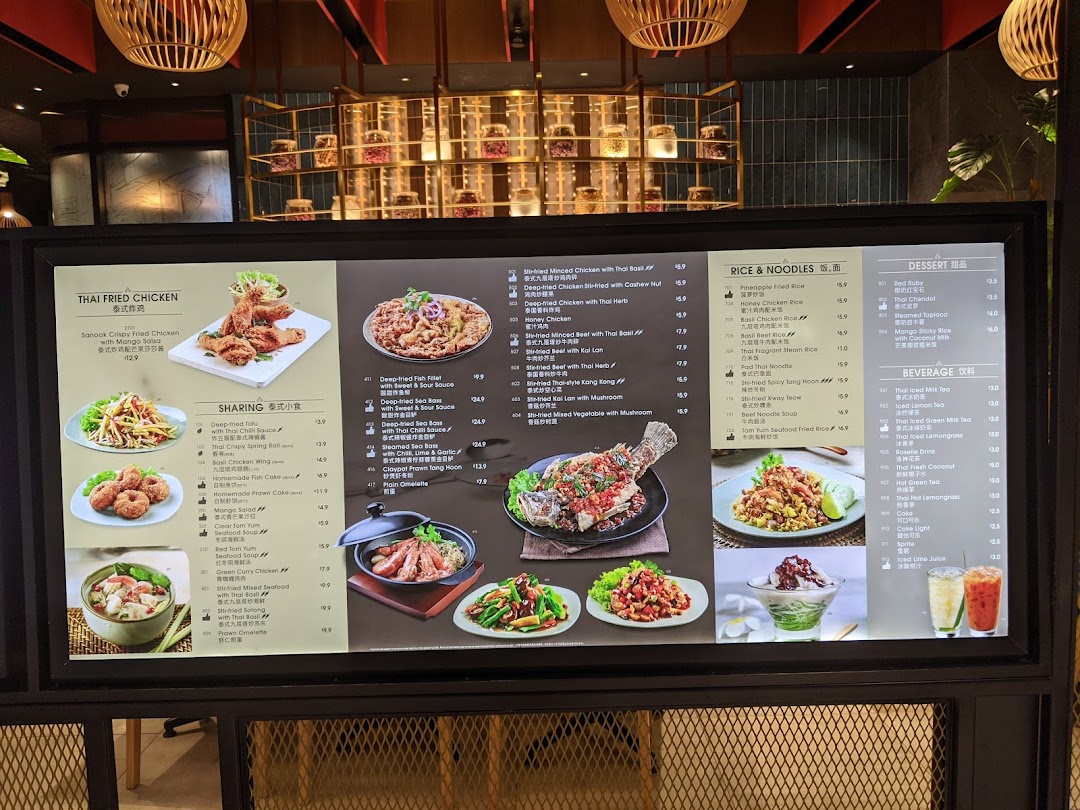 A vibrant digital menu board showcasing a variety of Thai dishes and beverages with prices.
