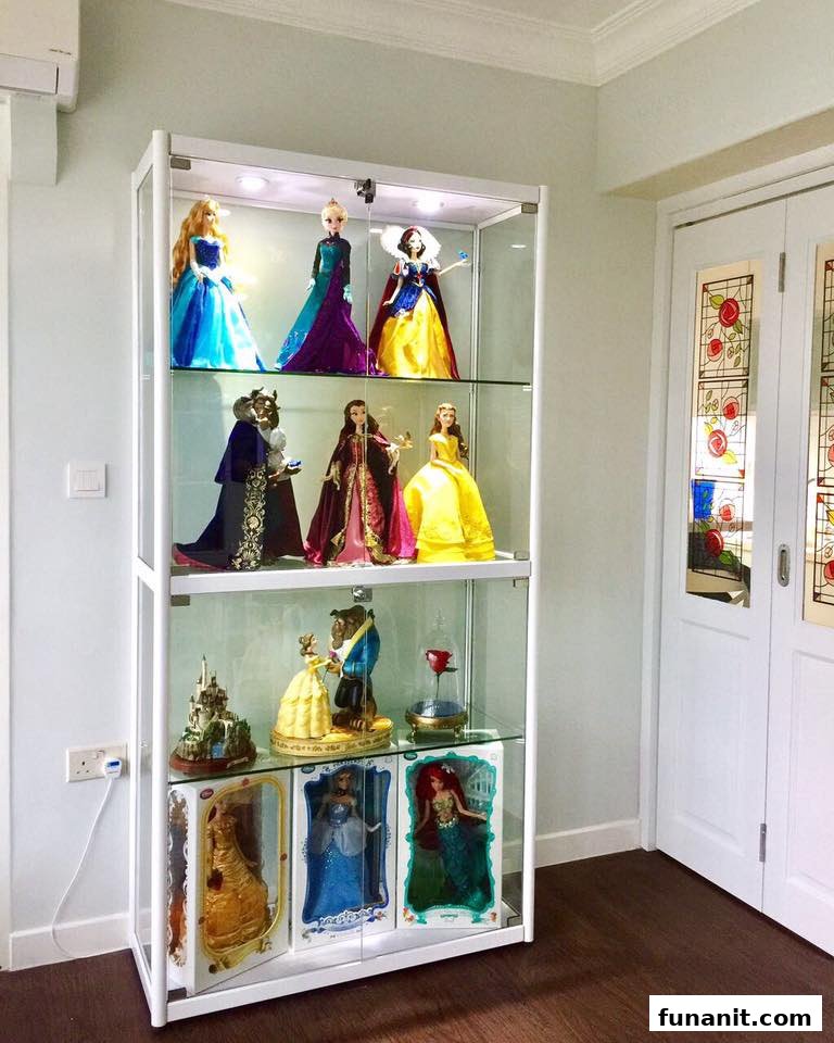 A brightly lit display cabinet showcasing a collection of popular character dolls and figurines.