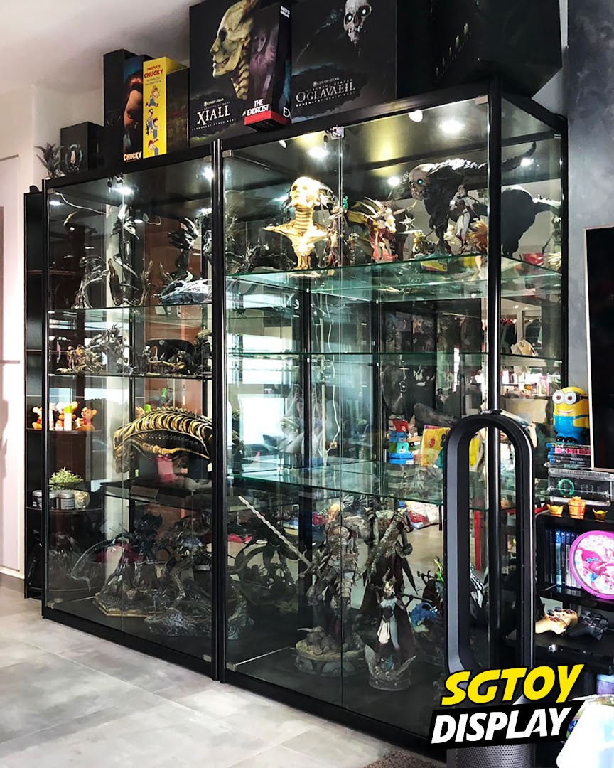 Large glass display cases showcase an impressive collection of detailed figures and statues.