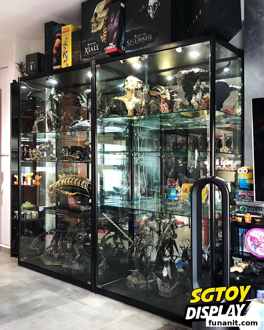 Large glass display cases showcase an impressive collection of detailed figures and statues.