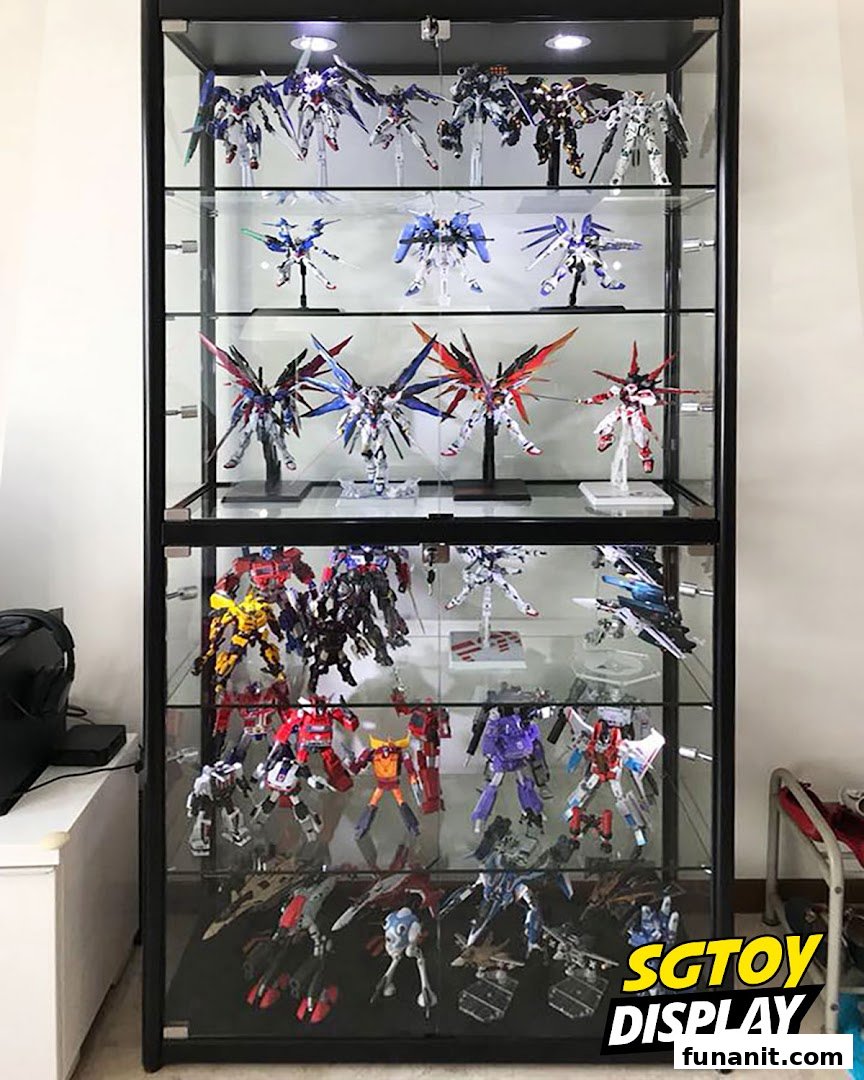 A display cabinet showcasing numerous detailed robot action figures and model kits.