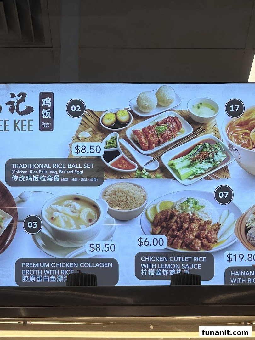 A digital menu board displaying various chicken rice and broth dishes with prices.