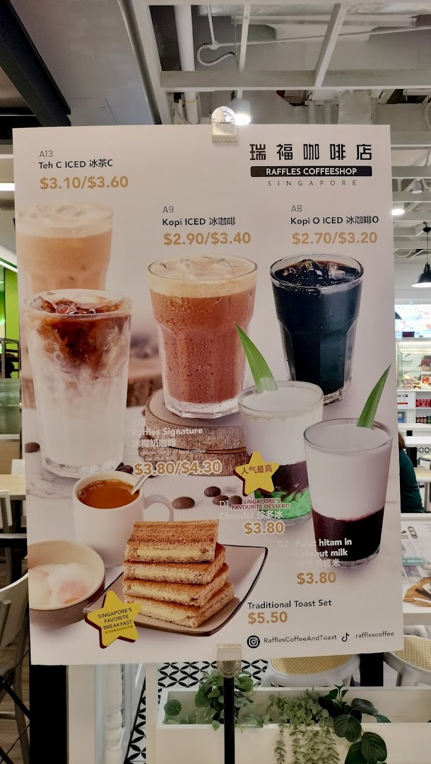 A menu board displaying traditional Singaporean coffee, tea, desserts, and toast sets with prices.