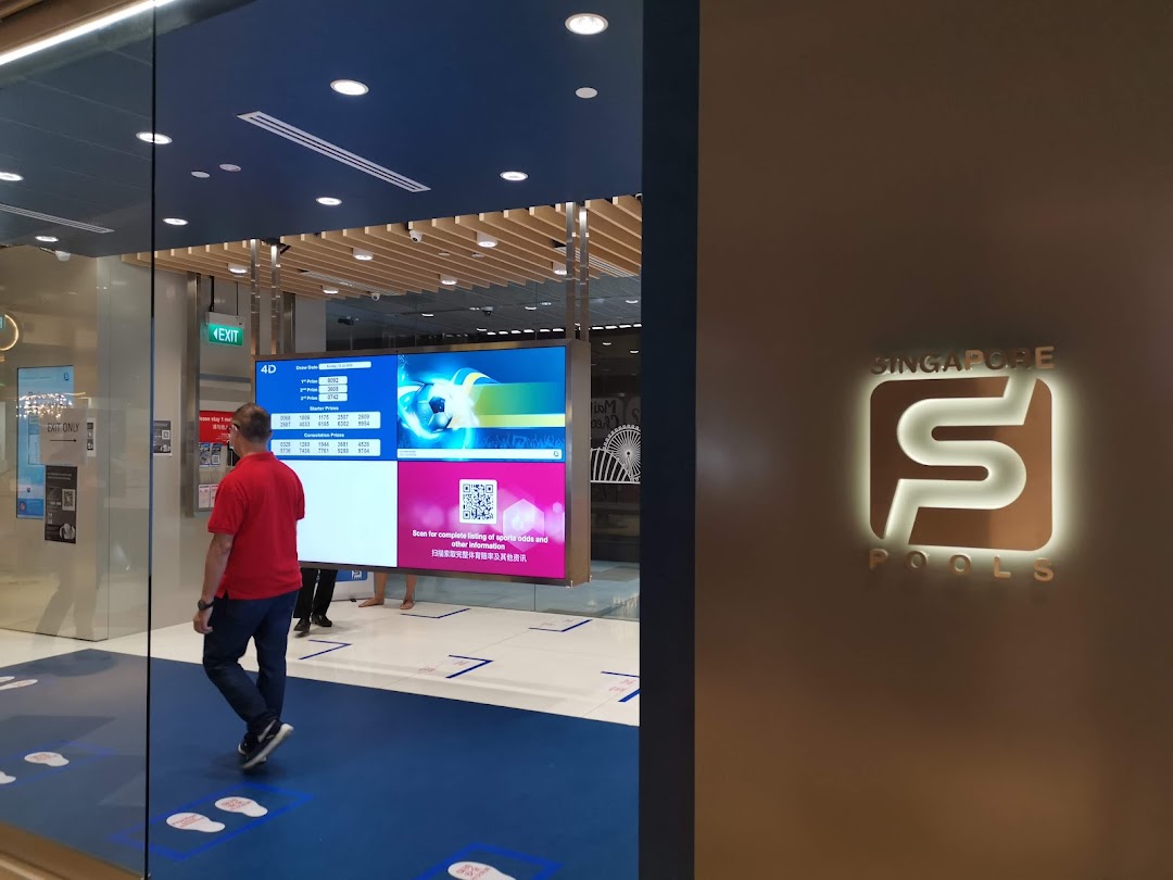 A customer enters the Singapore Pools Funan Branch, featuring digital displays and the illuminated logo.