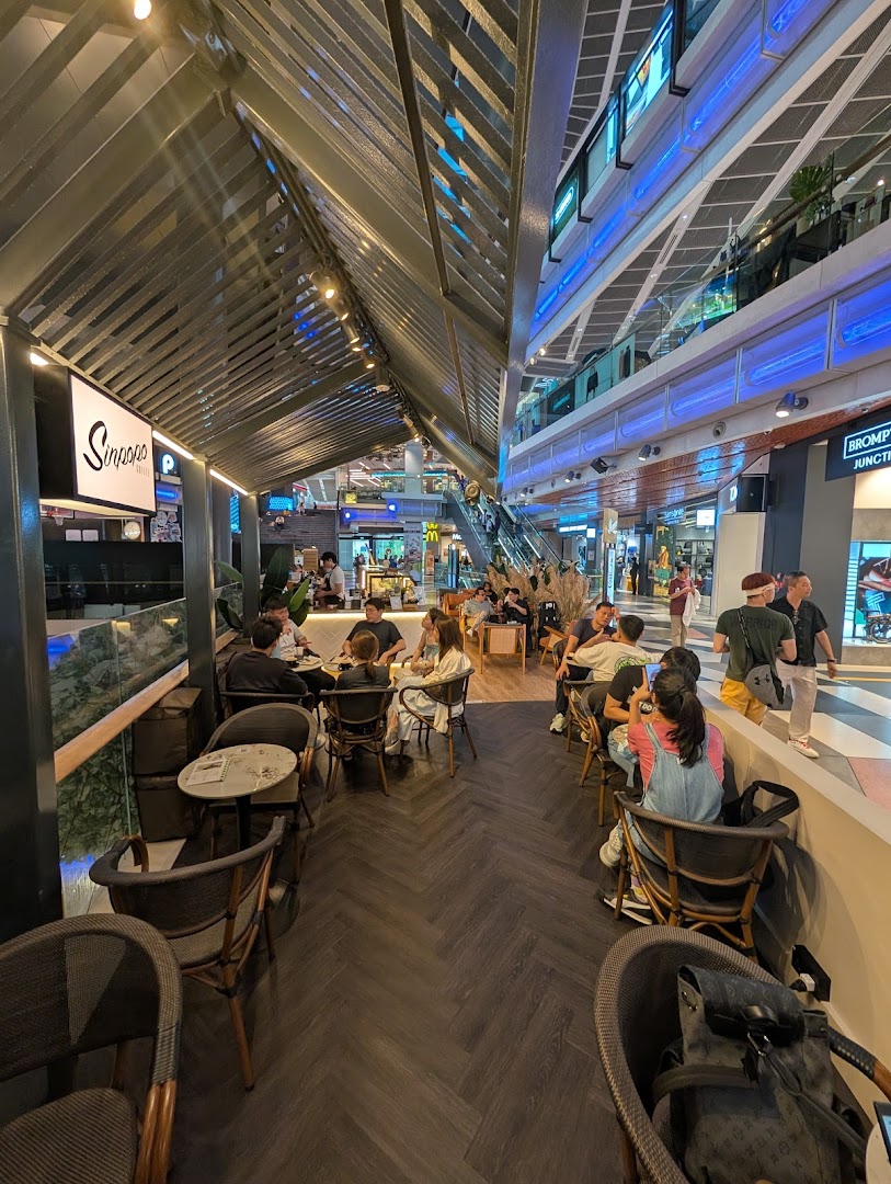 Customers are seated and enjoying the ambiance inside Sinpopo Coffee at Funan mall.
