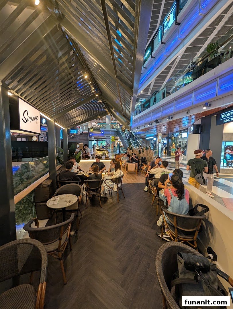 Customers are seated and enjoying the ambiance inside Sinpopo Coffee at Funan mall.