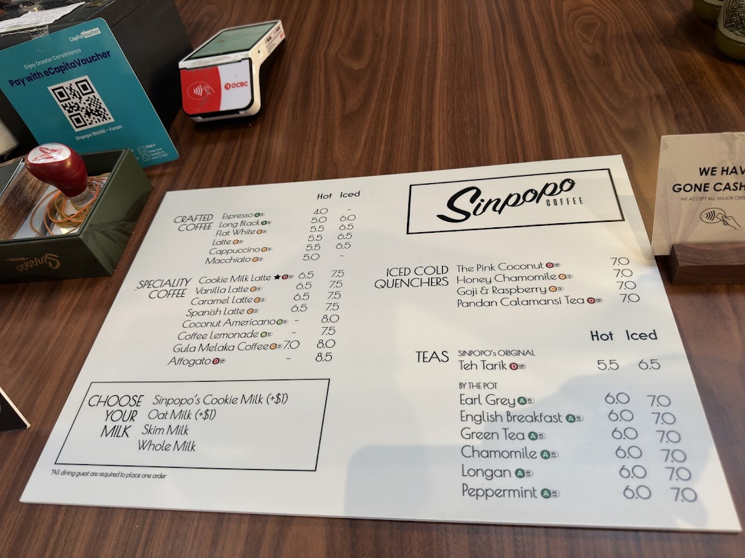 A menu from Sinpopo Coffee displaying various hot and iced beverages, including coffees, teas, and quenchers.
