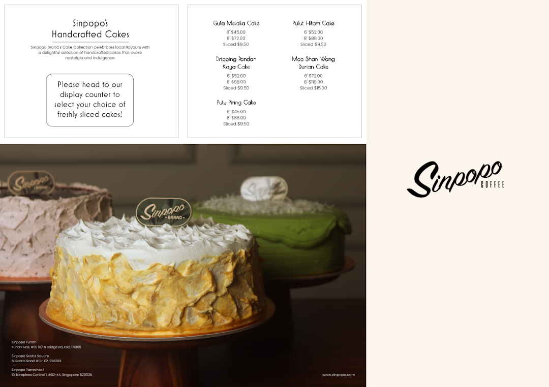 A display of Sinpopo's handcrafted cakes alongside their menu with prices and descriptions.