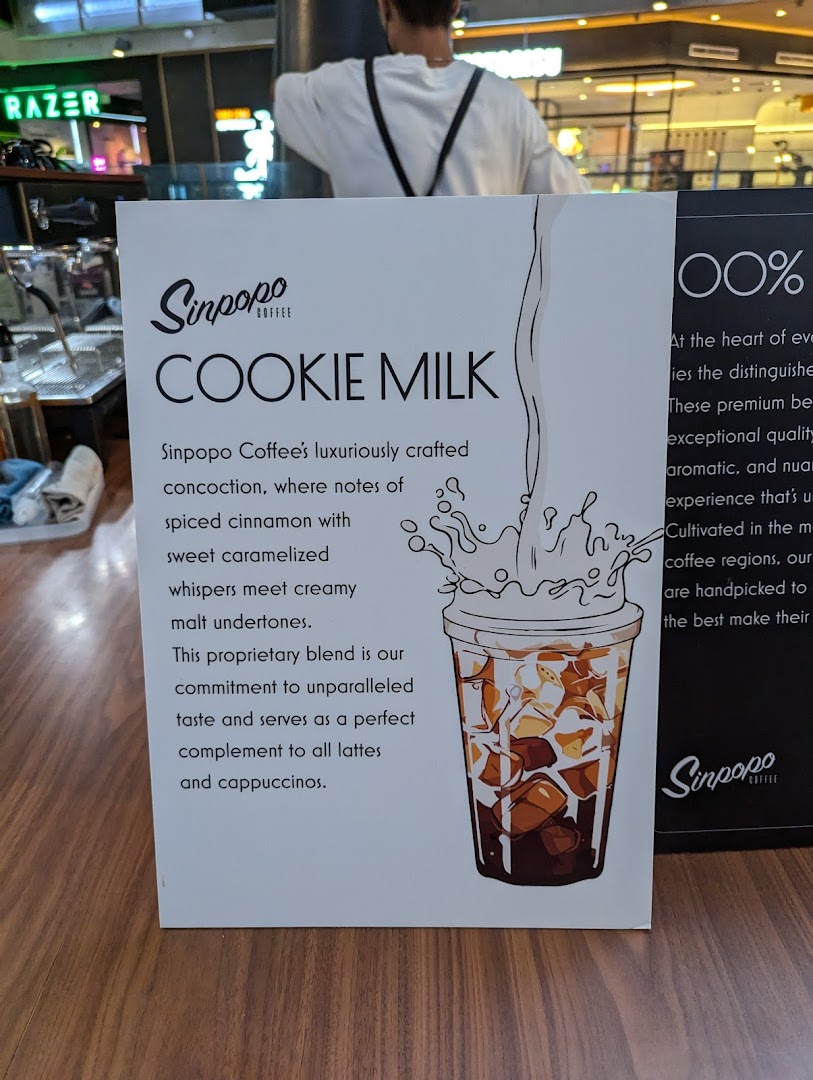 A Sinpopo Coffee display board detailing their unique 'Cookie Milk' beverage.