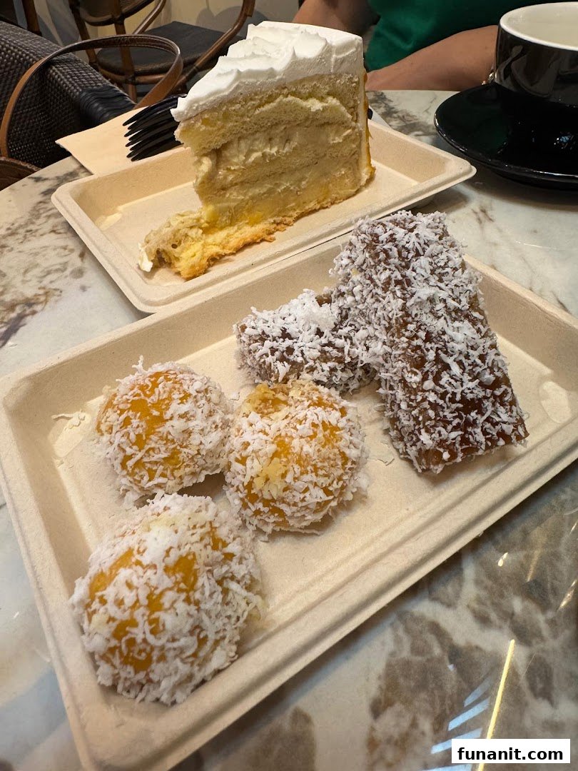 A slice of cake and traditional coconut-dusted desserts served on eco-friendly trays.