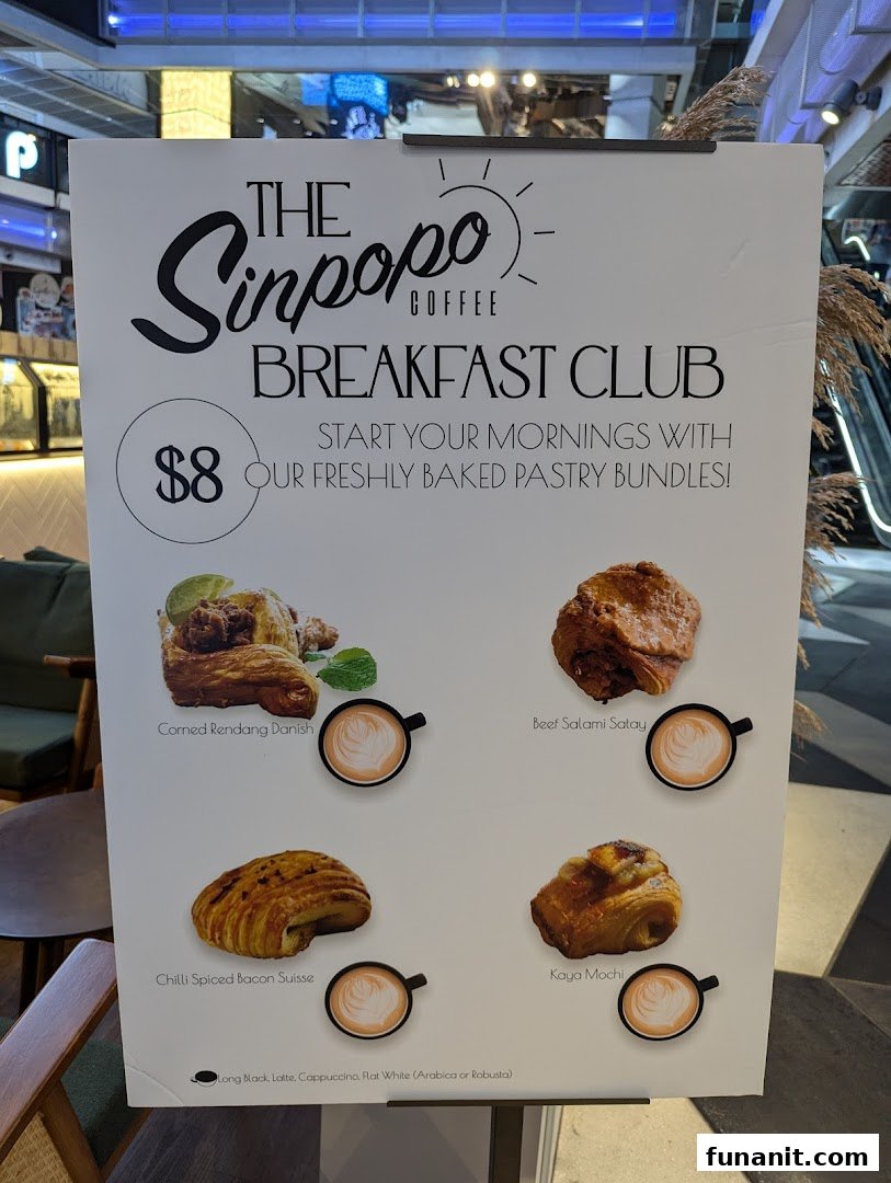 A promotional stand for Sinpopo Coffee's 'Breakfast Club' featuring pastry bundles and coffee options.