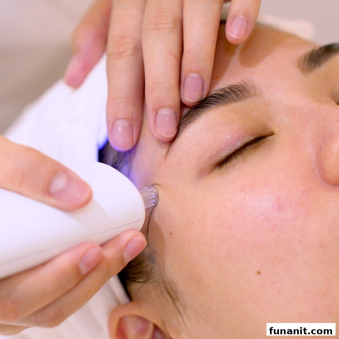Close-up of a person receiving a facial treatment with a specialized device at Skin Belief.