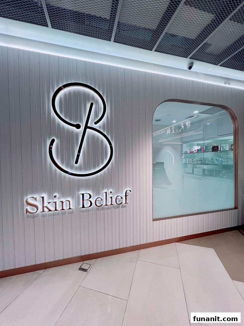 The illuminated exterior signage and entrance of Skin Belief, a beauty and skincare shop.
