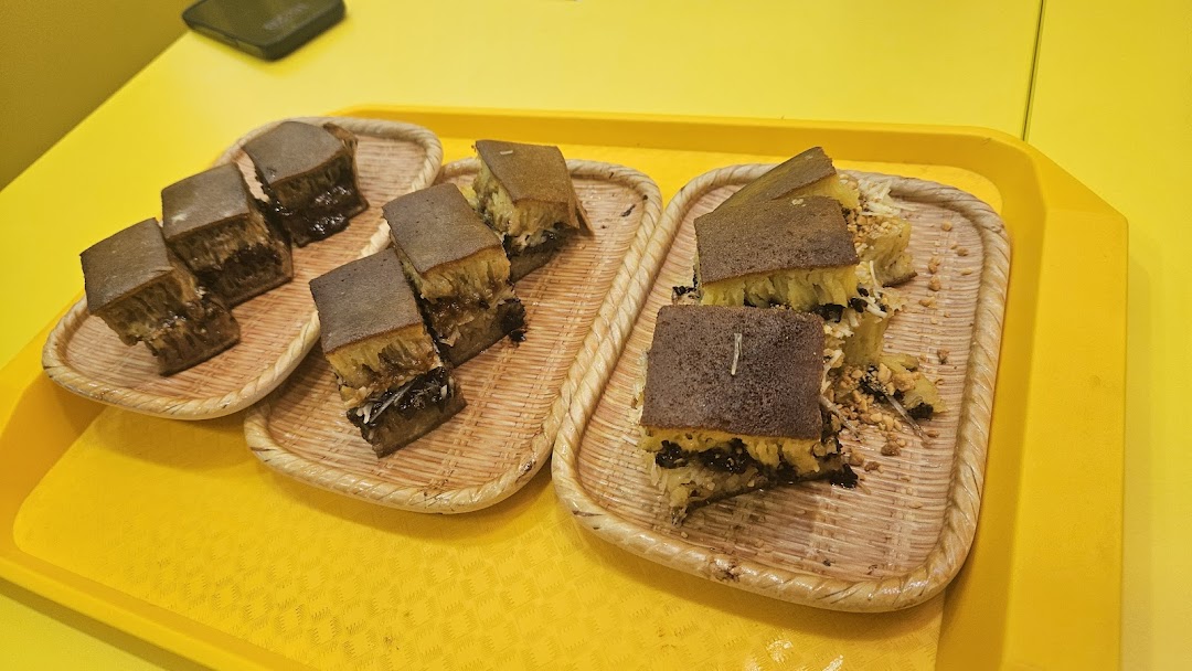 Slices of delicious martabak, a sweet Indonesian pancake, served on woven trays.