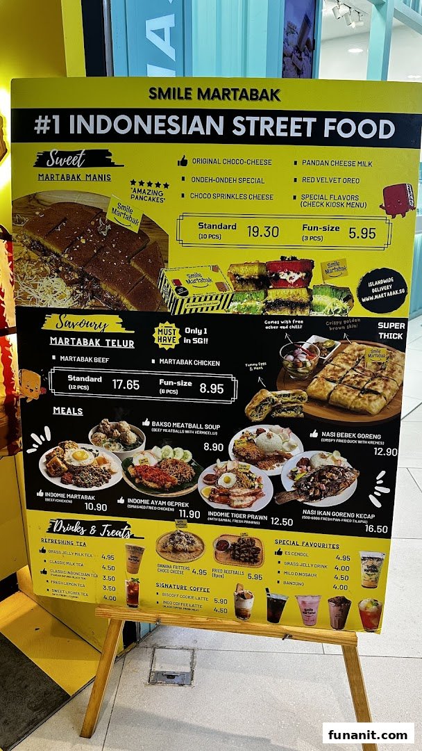 A vibrant yellow menu board for Smile Martabak, showcasing sweet and savoury Indonesian street food.