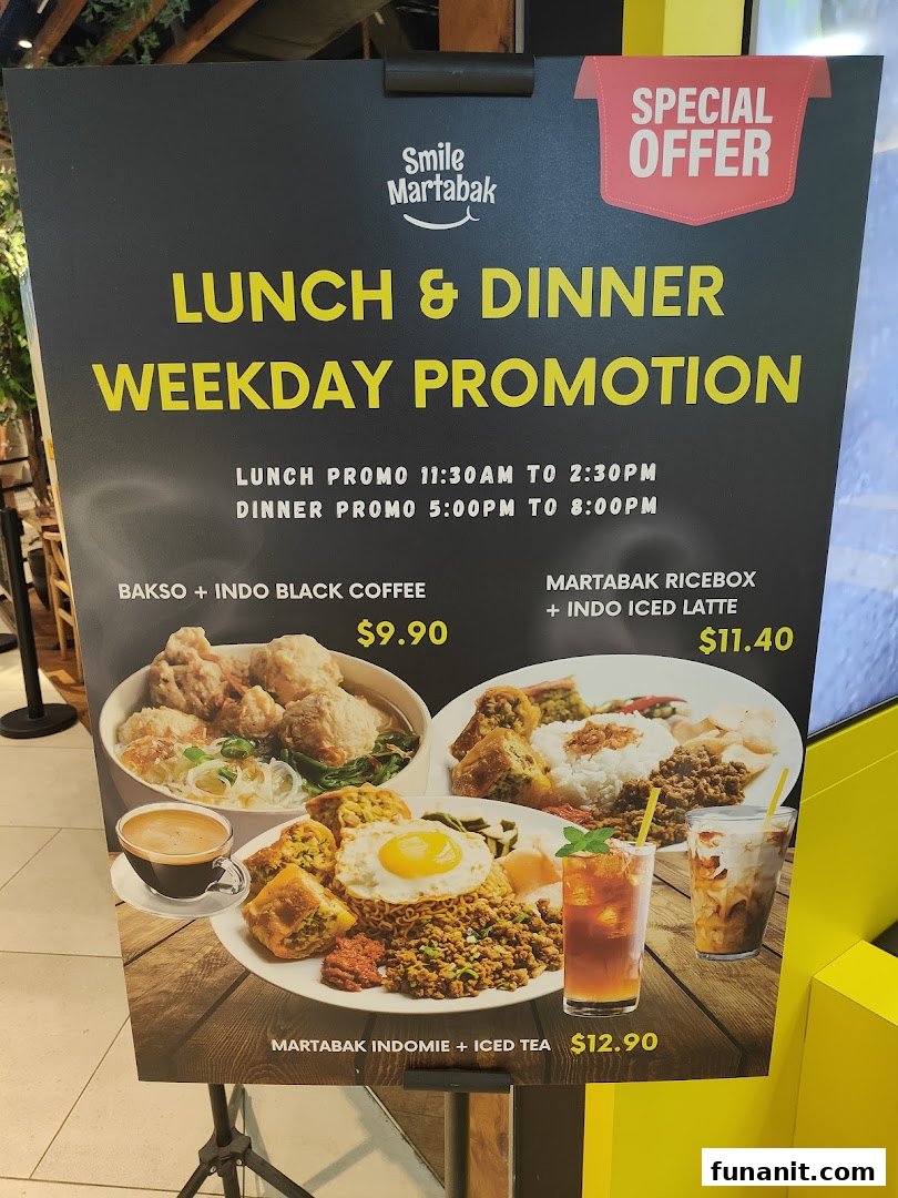 A promotional standee for Smile Martabak's weekday lunch and dinner promotions featuring various Indonesian dishes.