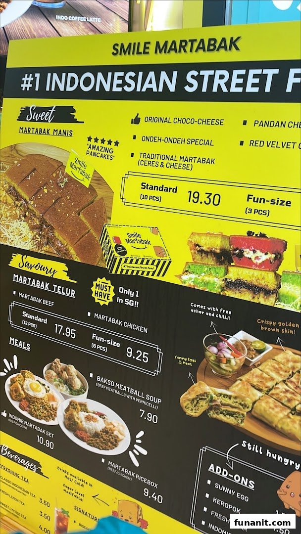 A vibrant yellow and black menu board displaying Indonesian street food, including sweet and savoury martabak.