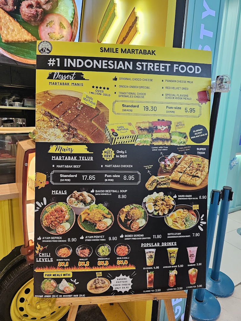 A vibrant menu board for Smile Martabak, showcasing Indonesian street food desserts, savory martabak, and meals.