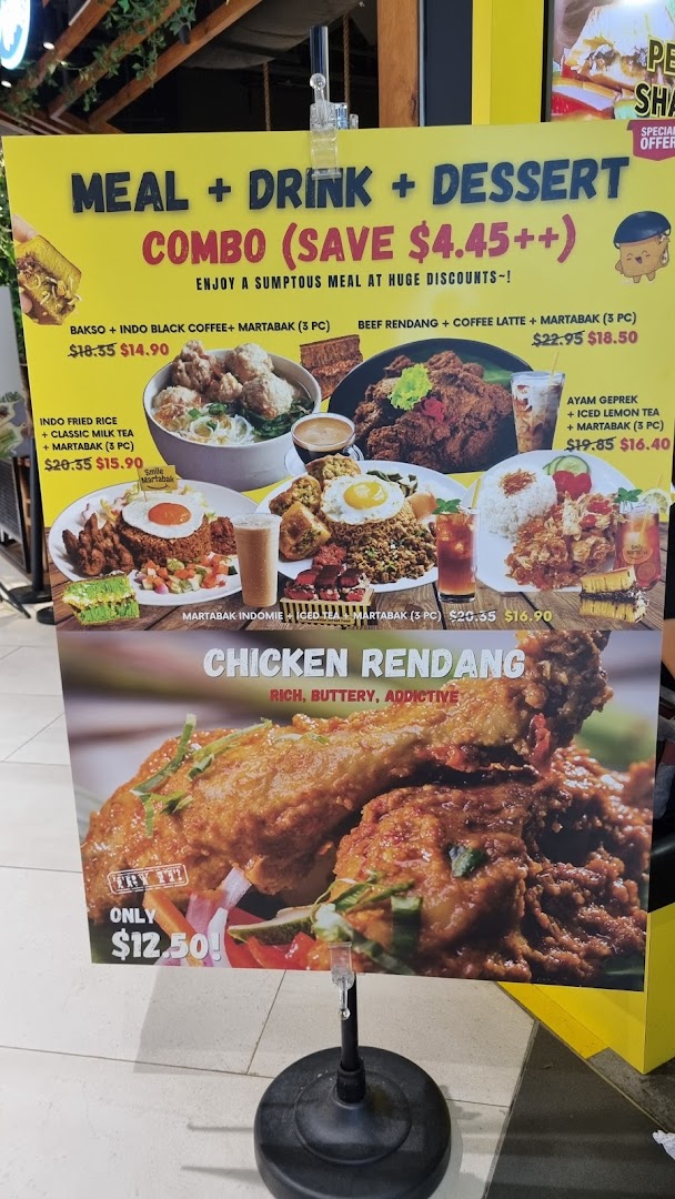 A vibrant menu board showcasing various Indonesian meal, drink, and dessert combo deals with discounted prices.