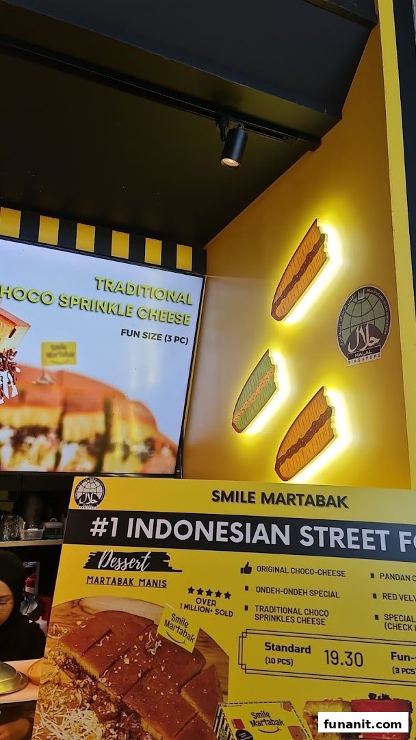 A vibrant display board at Smile Martabak showcasing their popular Indonesian desserts and pricing.