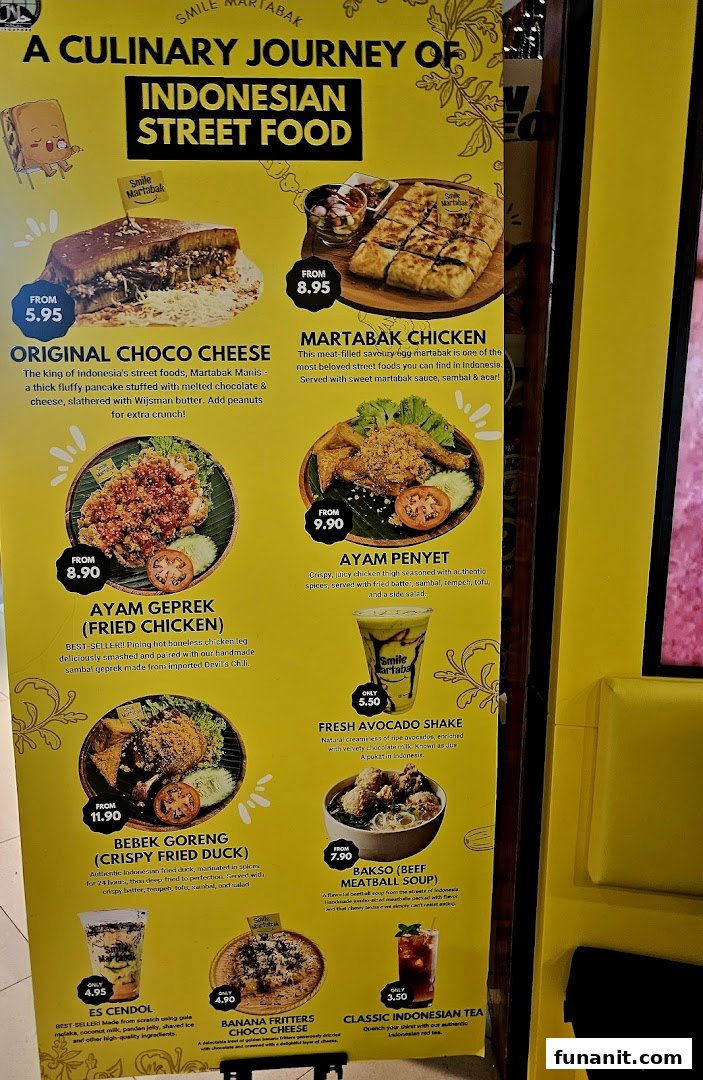 A vibrant yellow menu board showcasing Indonesian street food dishes and drinks from Smile Martabak.