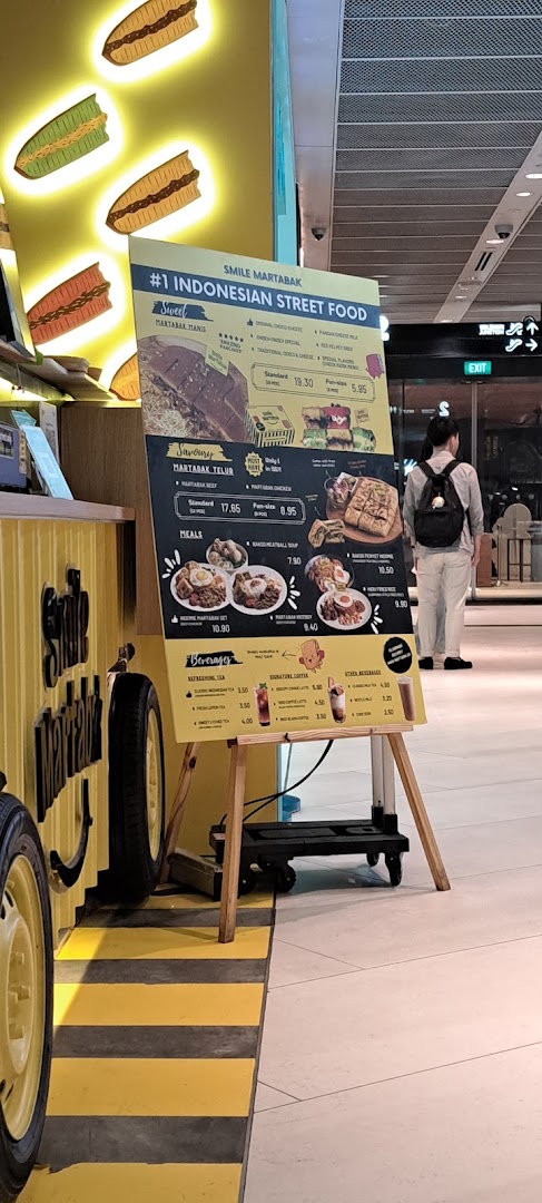 A vibrant menu board for Smile Martabak, showcasing Indonesian street food, sweet and savory martabak, meals, and beverages.