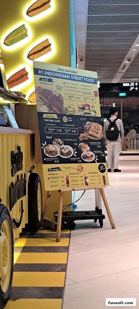 A vibrant menu board for Smile Martabak, showcasing Indonesian street food, sweet and savory martabak, meals, and beverages.