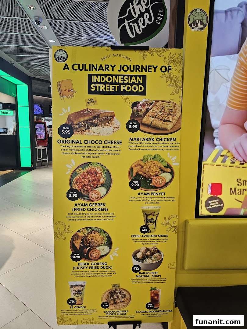 A large yellow menu board for Smile Martabak, showcasing Indonesian street food dishes and drinks.