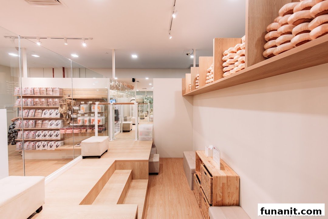 Bright, modern interior of a dancewear shop featuring ballet shoes, apparel, and seating areas.