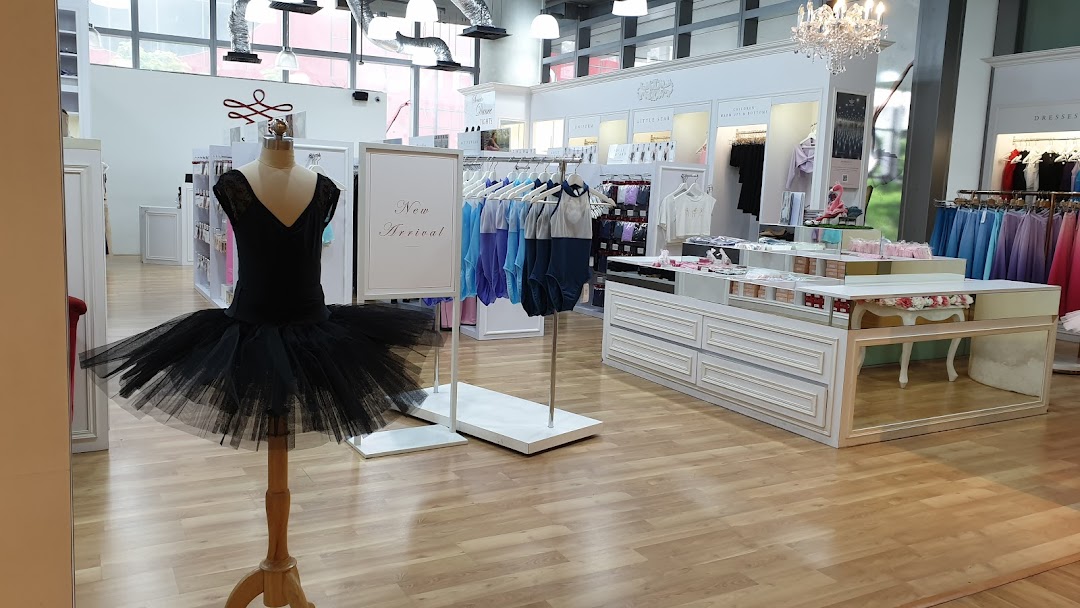 Interior view of Sonata Flagship Store, featuring dancewear, tutus, and leotards on display.