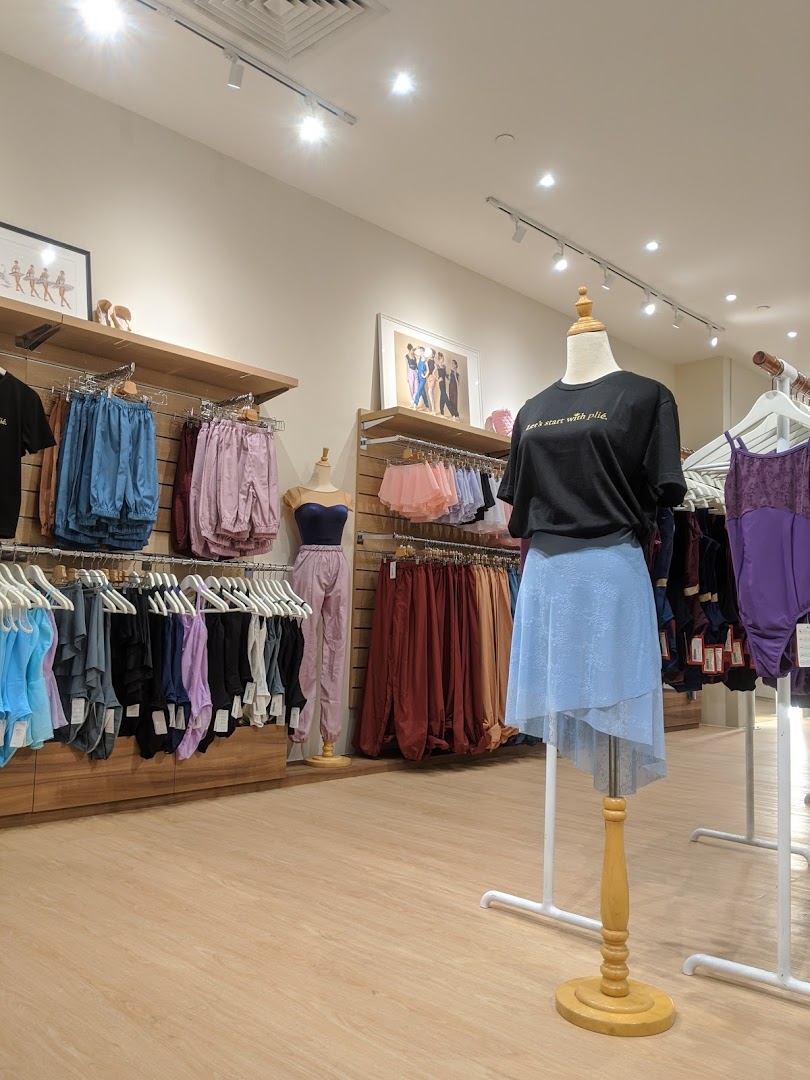 Interior view of Sonata Flagship Store showcasing dancewear, activewear, and accessories on mannequins and racks.