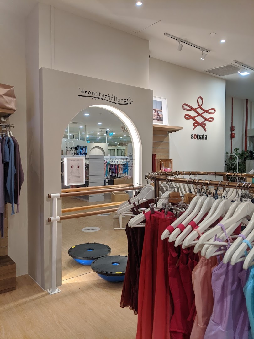 Interior view of Sonata Flagship Store, showcasing colorful dancewear, ballet barre, and fitness equipment.