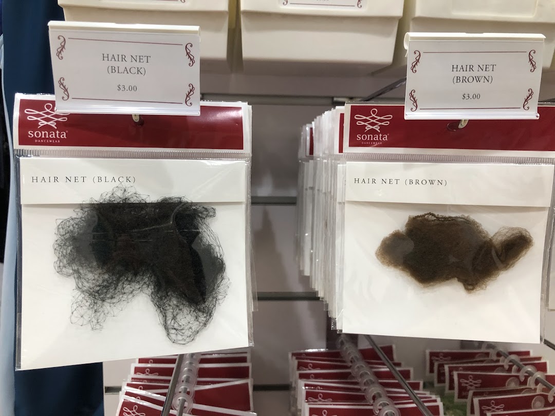 Close-up of black and brown hair nets displayed for sale at Sonata Dancewear.