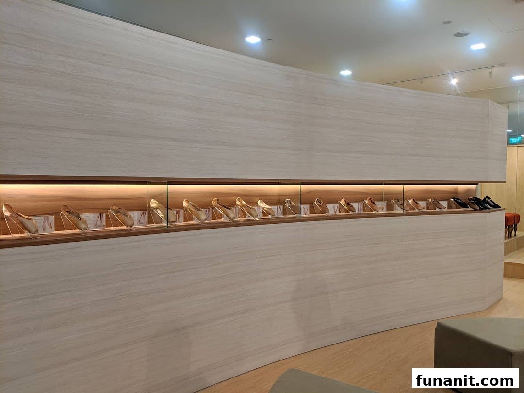 An elegant display of ballet slippers and shoes in a well-lit, modern retail interior.
