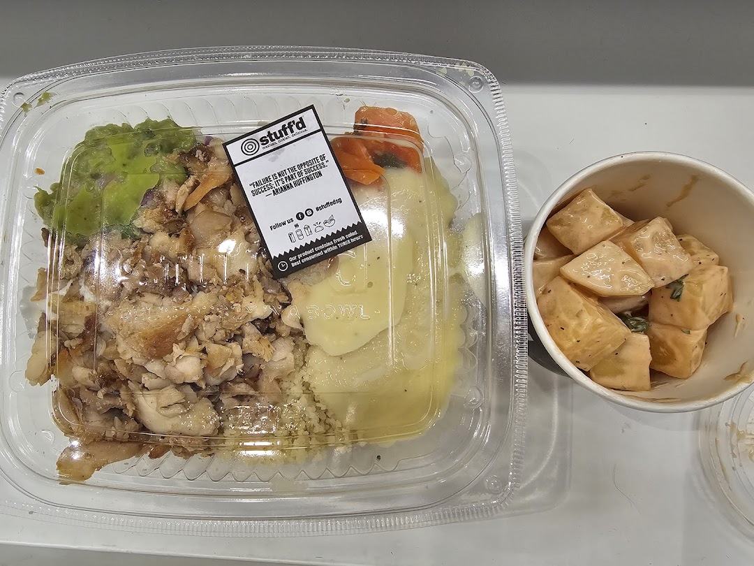 A healthy meal bowl with chicken, guacamole, and mashed potatoes, alongside a side of potato salad.