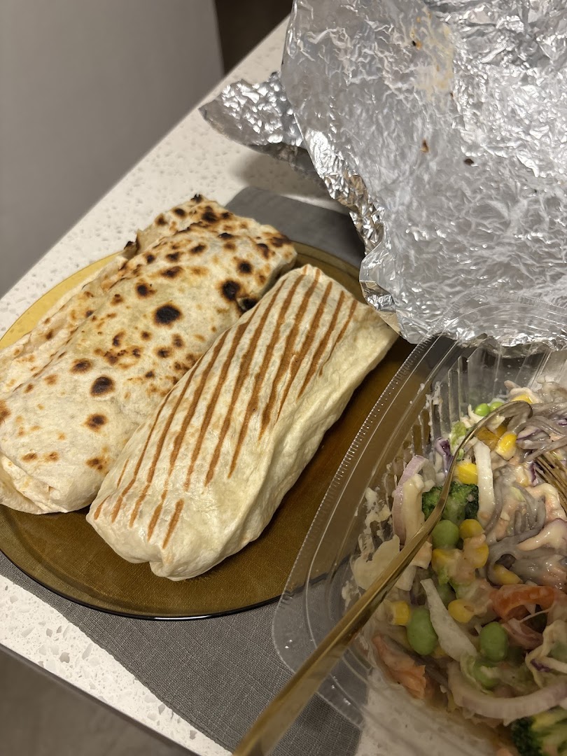 Two delicious wraps, one grilled, served with a fresh salad from Stuffd.