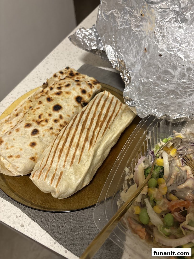 Two delicious wraps, one grilled, served with a fresh salad from Stuffd.