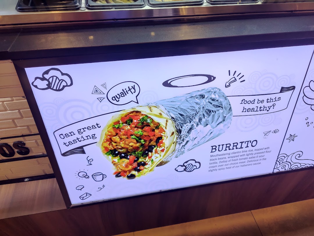 A bright display board featuring a large, appetizing burrito with descriptive text and playful graphics.