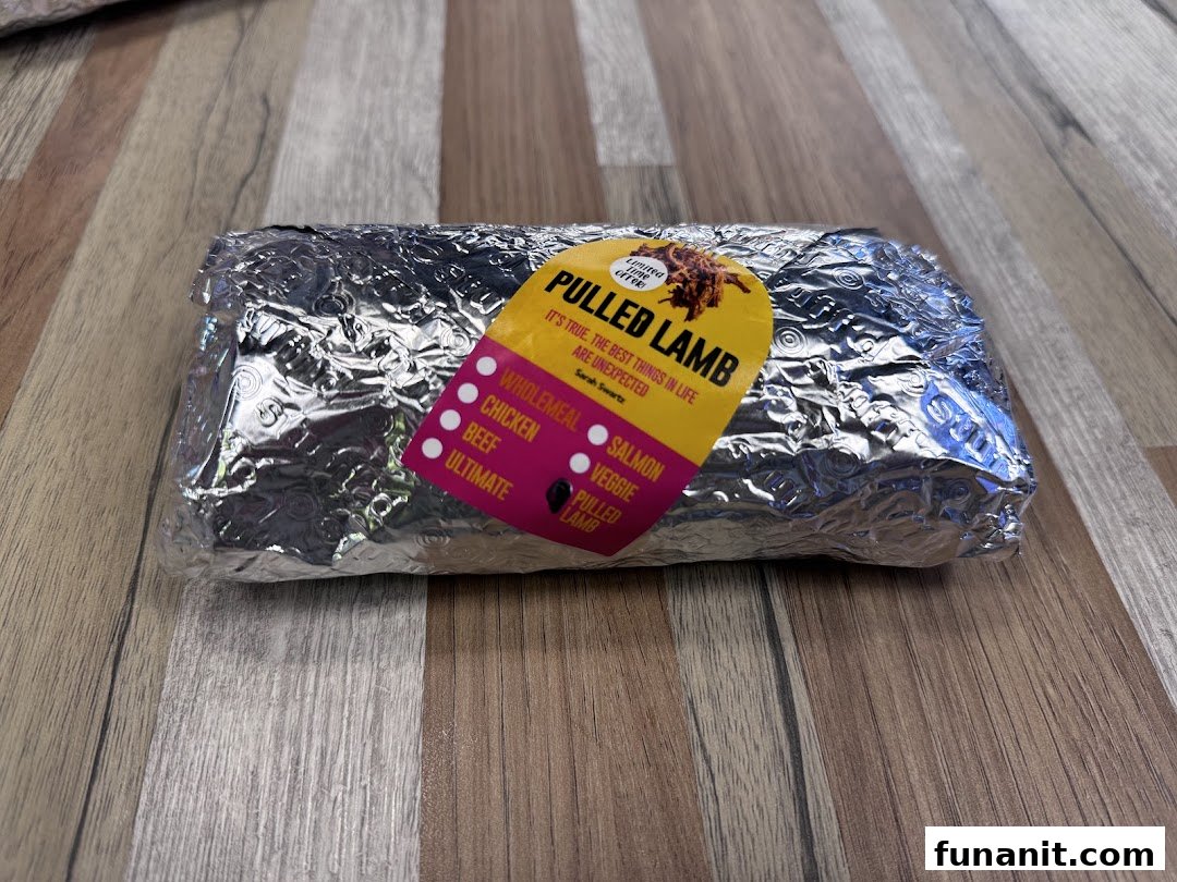 A foil-wrapped food item from Stuffd with a 'Pulled Lamb' label, featuring various filling options.
