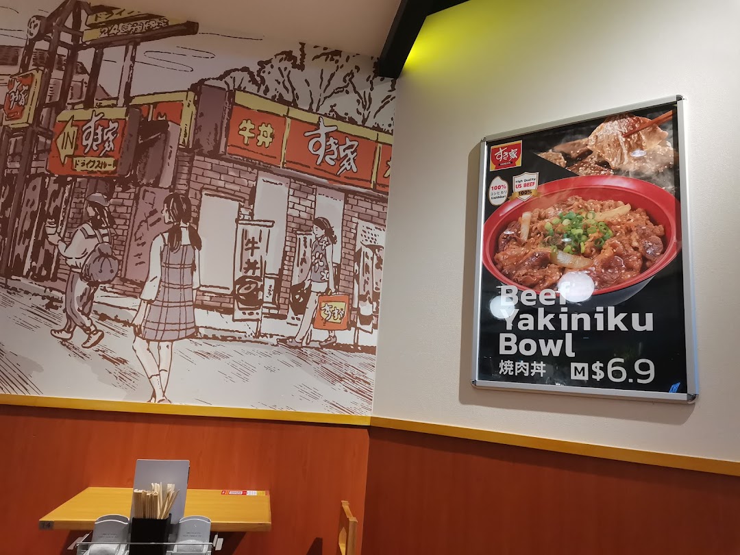 Interior view of Sukiya featuring a Japanese street mural and a promotional poster for Beef Yakiniku Bowl.