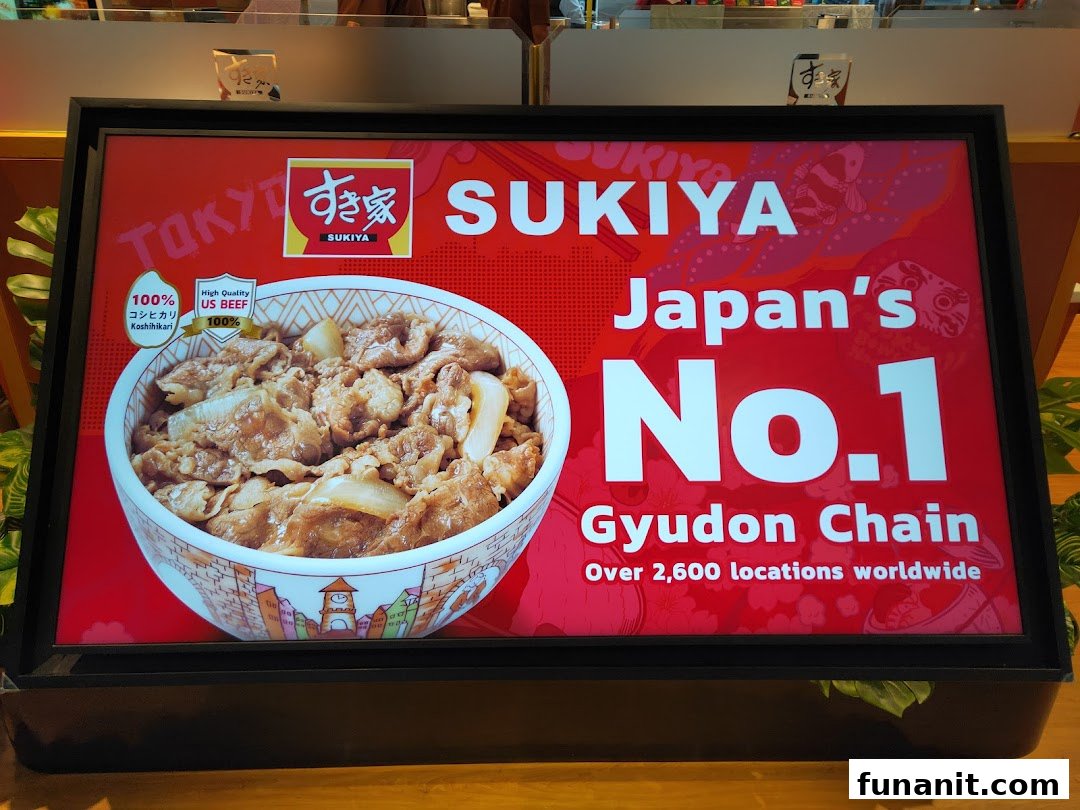 A promotional display for Sukiya featuring a gyudon bowl and highlighting its status as Japan's No.1 Gyudon Chain.