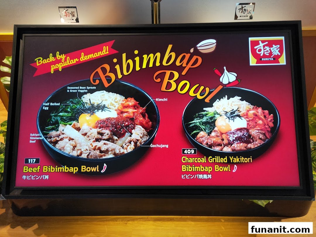 A digital menu board at Sukiya showcasing two types of Bibimbap bowls with their ingredients.