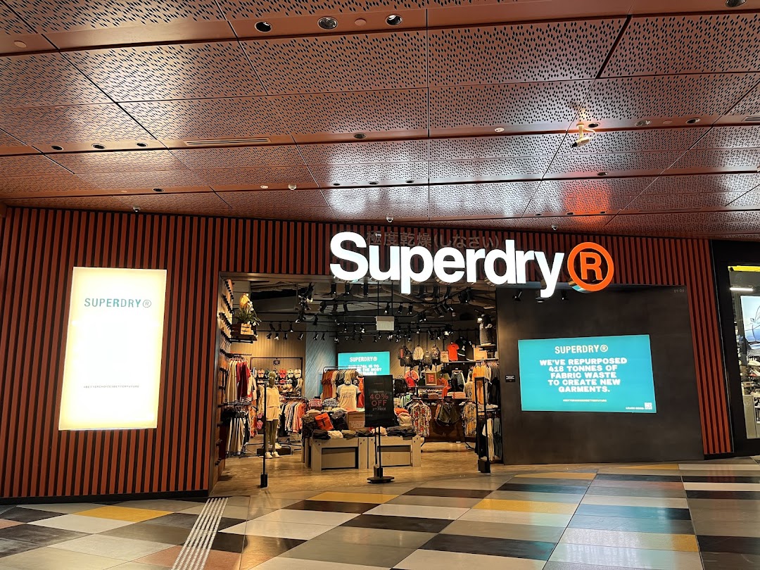 The Superdry store entrance showcasing its modern design and sustainable fashion initiatives.