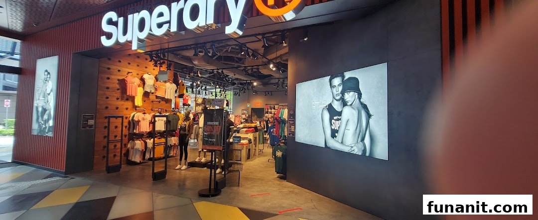 The Superdry store entrance showcasing its vibrant apparel displays and prominent branding.