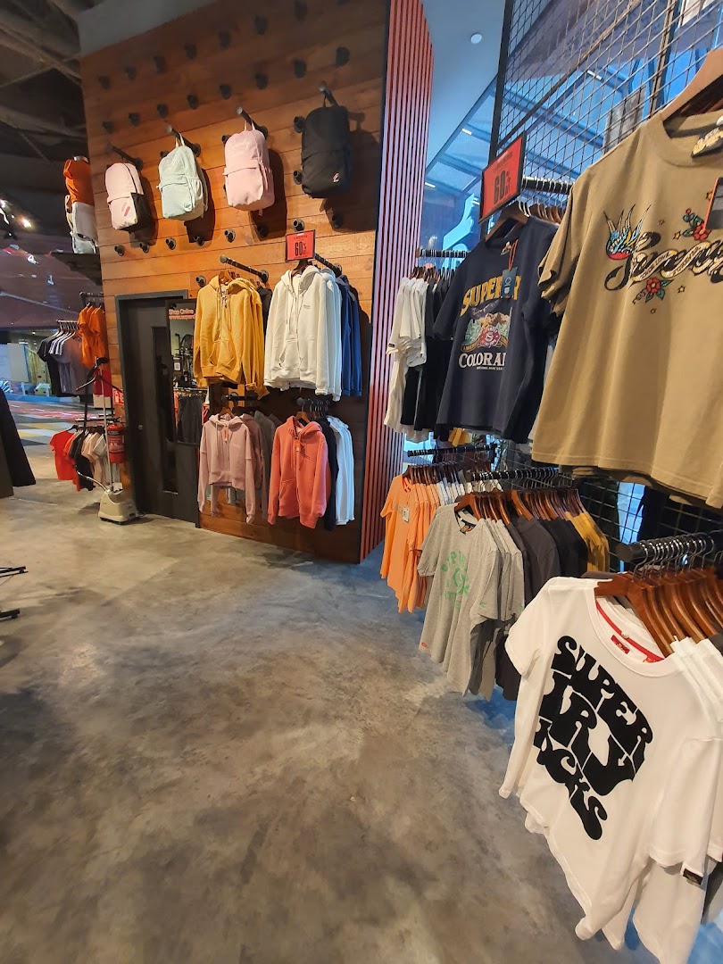 Interior view of a Superdry store showcasing a variety of apparel and accessories on display.
