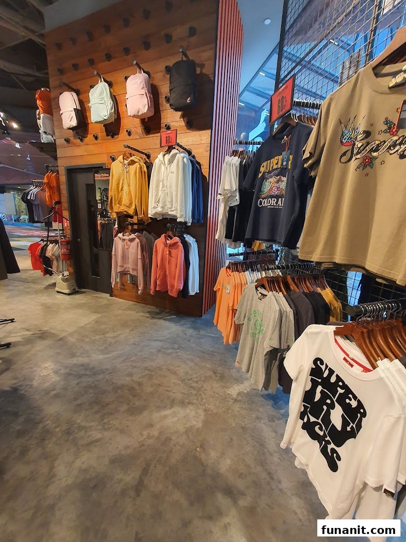 Interior view of a Superdry store showcasing a variety of apparel and accessories on display.