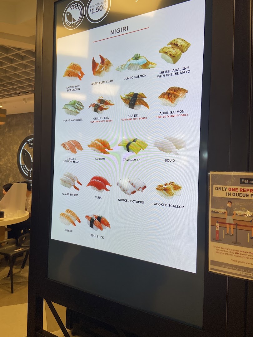 A digital menu board displaying various nigiri sushi options with prices at Sushi Express.