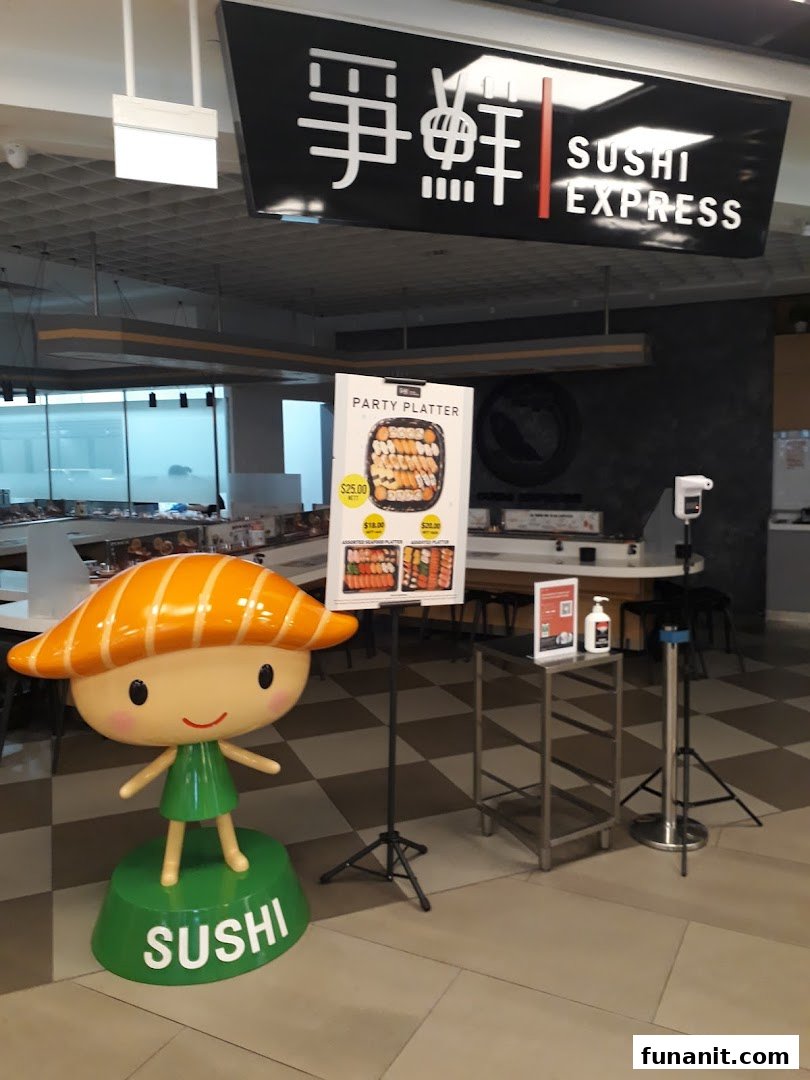 The entrance of Sushi Express, featuring a sushi mascot and a promotional display for party platters.