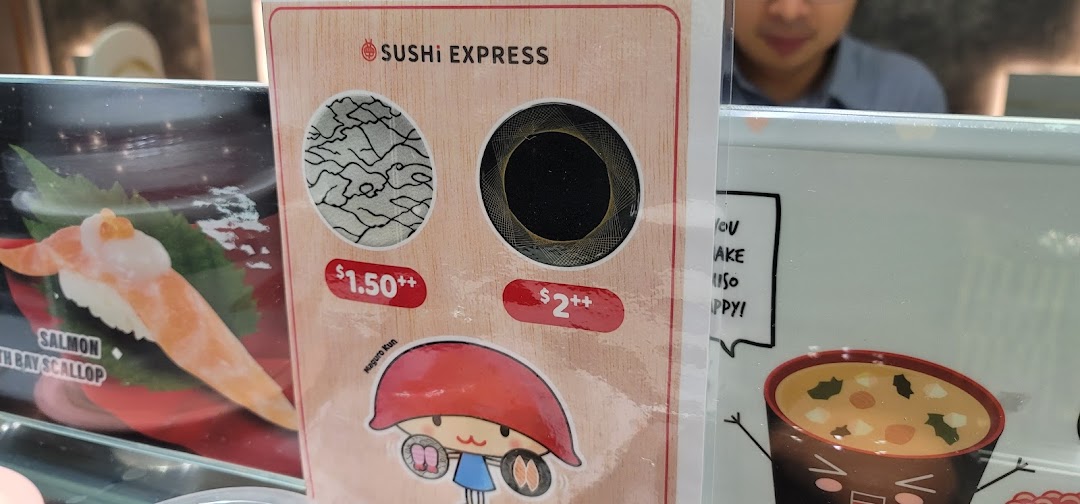 A display board showing sushi prices and a featured salmon sushi item at Sushi Express.